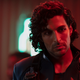 Marco Inaros (Keon Alexander) wears a military uniform in a red-tinged scene from The Expanse.